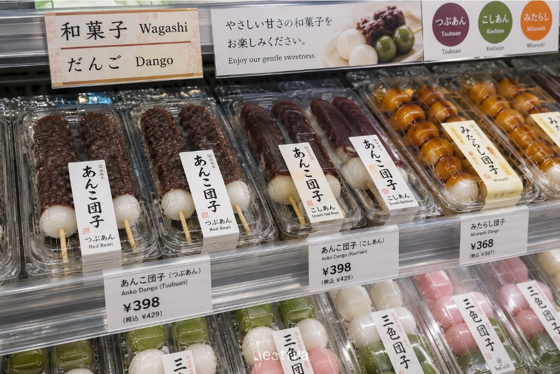 Fresh and packaged anko dango displayed at a Japanese specialty market