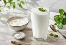Traditional ayran yogurt drink served cold with fresh mint, yogurt and salt