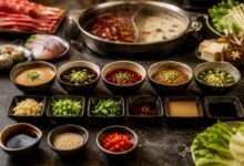 Five hot pot dipping sauce combinations with sesame, shacha, soy-vinegar, chile oil, garlic, scallions, and cilantro