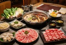 How to order hot pot with divided broth, sliced meat, tofu, vegetables, dumplings, noodles, sauces, and restaurant menu