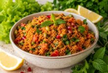 Traditional Turkish kısır with lettuce, lemon, fresh herbs and pomegranate seeds