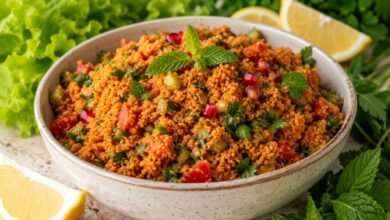 Traditional Turkish kısır with lettuce, lemon, fresh herbs and pomegranate seeds