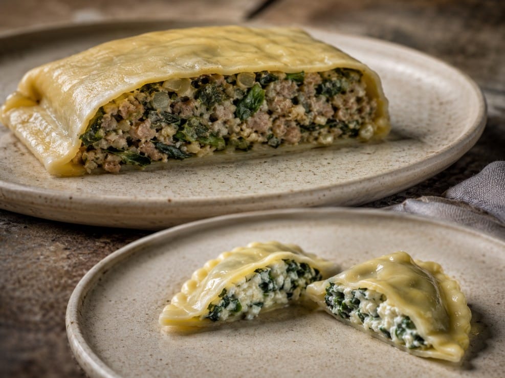 Cut-open Maultaschen and ravioli showing differences in wrapper thickness filling density and scale