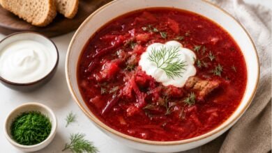 Traditional Ukrainian borshch with sour cream, fresh dill and bread