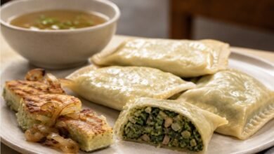 Vegetarian Maultaschen with spinach, mushroom and onion filling served with vegetable broth and pan-fried slices