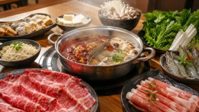 What Is Hot Pot? How It Works, Regional Styles and What Makes It Different 12 Steaming divided hot pot with sliced meat, shrimp, tofu, mushrooms, vegetables, dumplings, and noodles