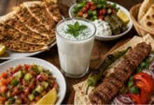 What to Eat With Ayran: Turkish Dishes, Spicy Foods and Everyday Pairings 2 Ayran served with Adana kebab, lahmacun, Çoban salatası, stuffed grape leaves and Turkish flatbread