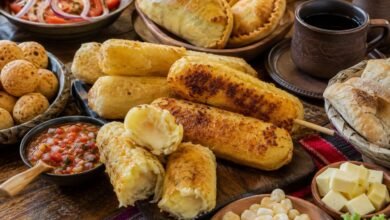 Sonso de yuca near me served on a Bolivian food table with salteñas, cuñapé, salad and coffee
