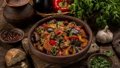 Traditional Georgian ajapsandali with eggplant, tomatoes, peppers, garlic and fresh herbs